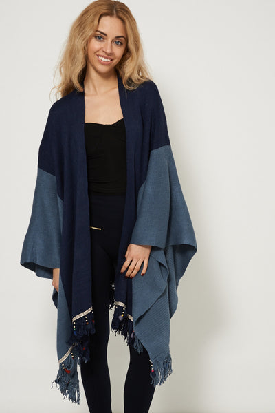 Knitted Poncho With Embellished Hem