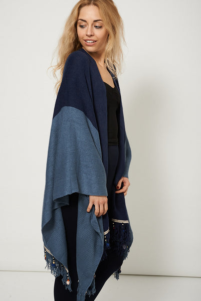 Knitted Poncho With Embellished Hem