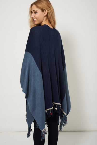 Knitted Poncho With Embellished Hem